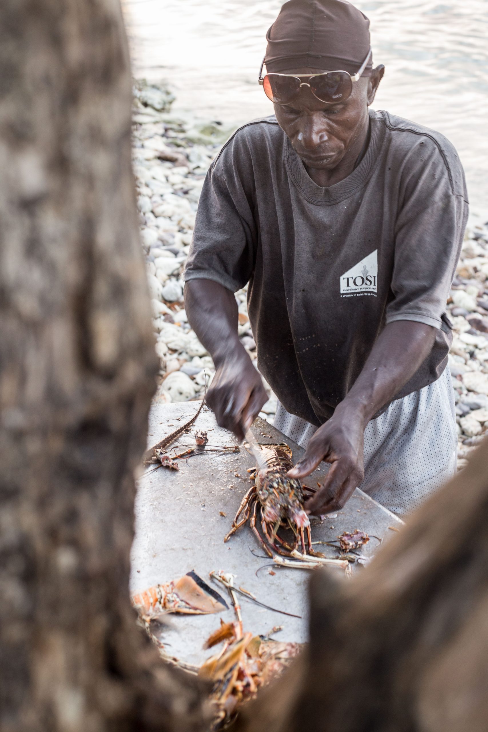 A local Filleting a fish in The Grenadines